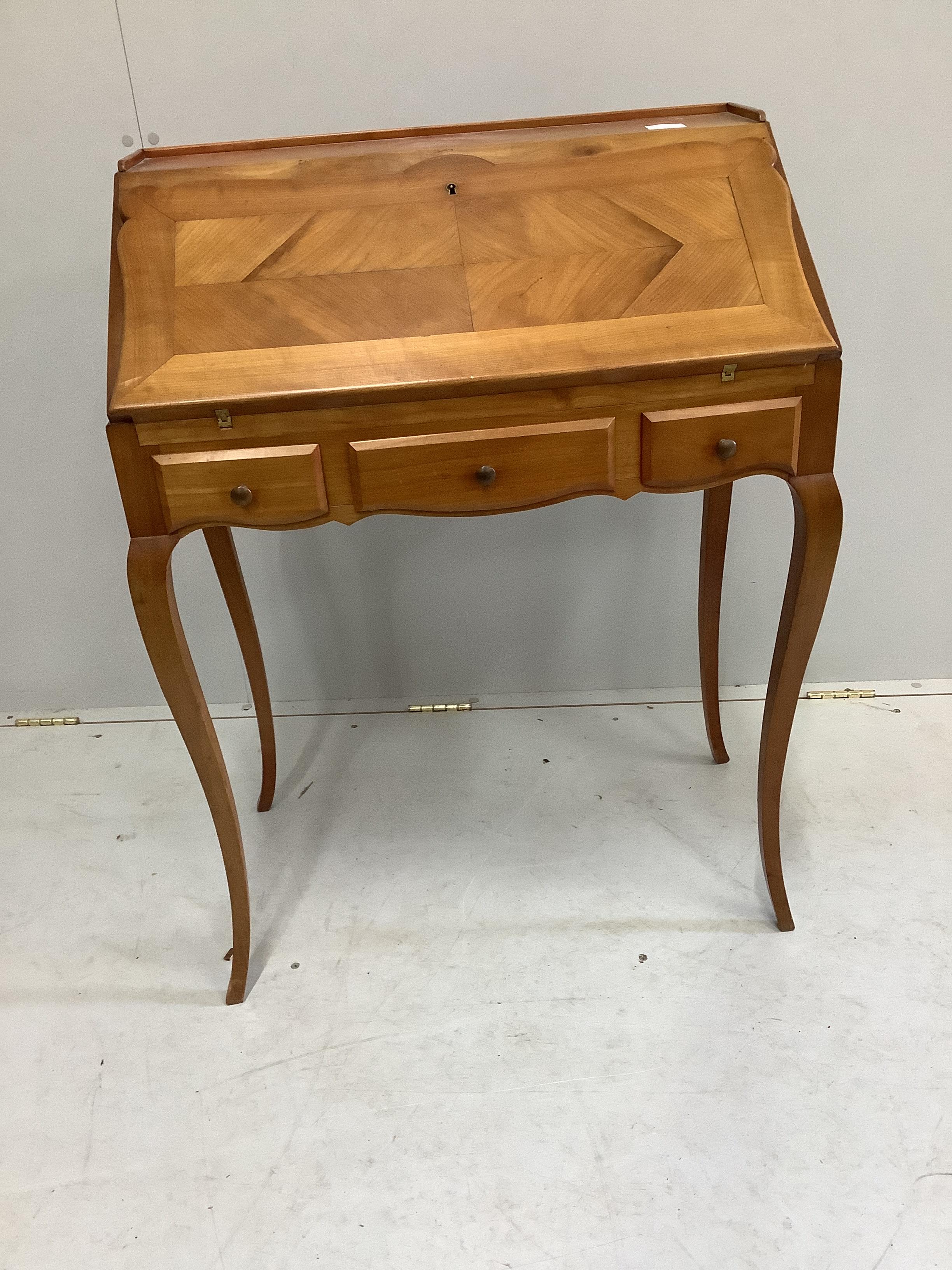 A Louis XV style walnut bureau de dame, width 69cm, depth 42cm, height 92cm